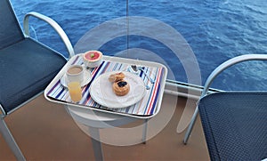 Breakfast tray on a table on a cruise ship balcony