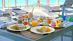 Breakfast in tropical hotel with sea view. Buffet food in restaurant in resort