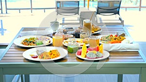 Breakfast in tropical hotel with sea view. Buffet food in restaurant in resort