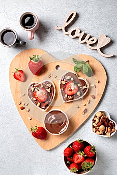 Breakfast for two, Valentines day food for couple in love with chocolate toasts and strawberry