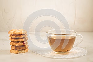 Breakfast whith cookies and glass cup whith tea/ Breakfast whith cookies and glass cup whith tea on a white background