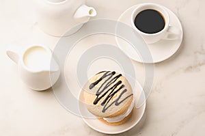 Breakfast whith white Coffe cup, milk and dessert/Breakfast whith white Coffe cup, milk and dessert on a white marble background.