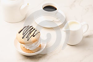 Breakfast whith white Coffe cup, milk, teapot and dessert/Breakfast whith white Coffe cup, milk, teapot and dessert on a white