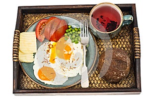 Breakfast. Wooden tray with dishes