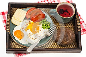 Breakfast. Wooden tray with dishes