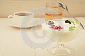 breakfast with yogurt and berries/breakfast with yogurt and berries on a wooden background.Copy space. selective focus