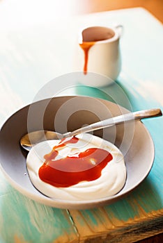 Breakfast with yogurt with jam