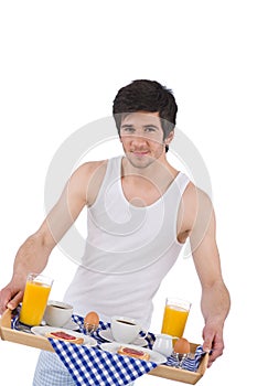 Breakfast - young man holding tray with breakfast