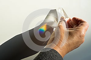 Breaking and dispersion of light in a prism, beautiful rainbow colors. photo