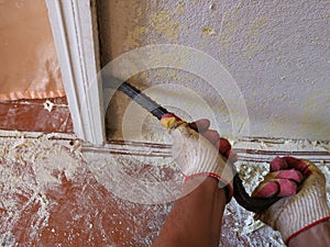 breaking a doorway with a crowbar