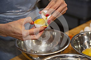 Breaking egg yolks