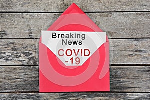 Breaking news Covid-19 words on paper
