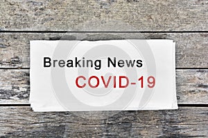 Breaking news Covid-19 words on paper