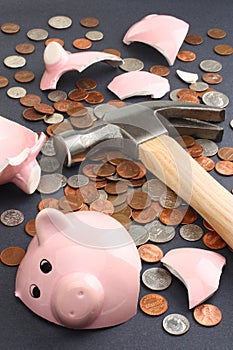 Breaking a piggy bank business & finance concept