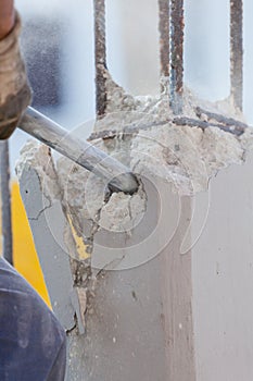 Breaking reinforced concrete with jackhammer