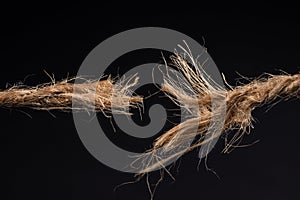 Breaking rope isolated on black background