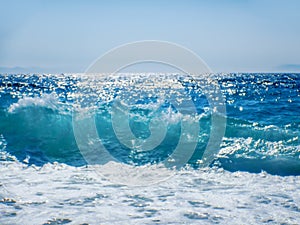 Breaking Wave of Blue Ocean on sandy beach Summer Background