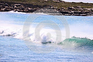 A breaking wave at Cape Point National Park in Cape Town, South Africa