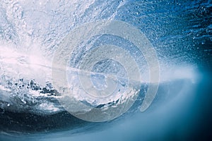 Breaking wave with foam and bubbles underwater. Transparent water