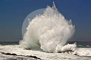 Breaking wave on ocean beach