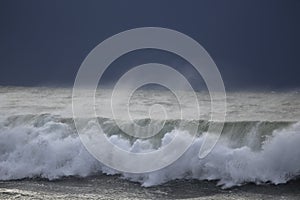 Breaking wave before storm