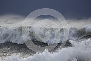 Breaking wave before storm