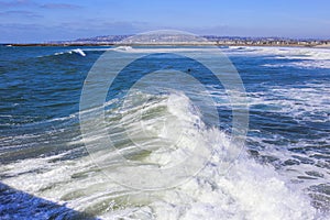 Breaking waves as taken from a pier