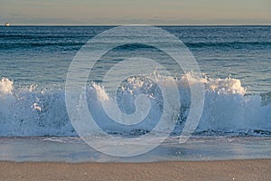 Breaking waves background on Mount Maunganui beach