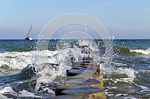 Breaking waves at groynes in Rostock, Germany