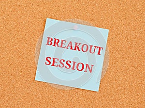 Breakout Sessions on light blue sticky note pined on a cork bulletin board