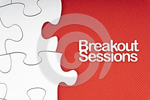 BREAKOUT SESSIONS text with jigsaw puzzle on red background. photo