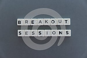 Breakout Sessions word made of square letter word on grey background