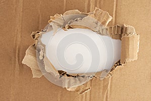 Breakthrough cardboard hole.