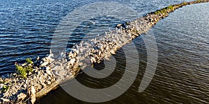 Breakwall with birds during summer