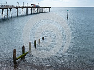 Breakwater alongside the Victorian pier at Teignmouth, Devon UK