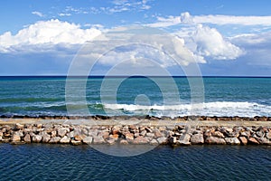 Breakwater and clouds