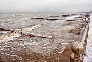 Breakwater covered by ice