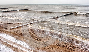 Breakwater covered by ice