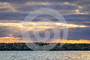 Breakwater and dramatic sky at Lista in southern Norway photo