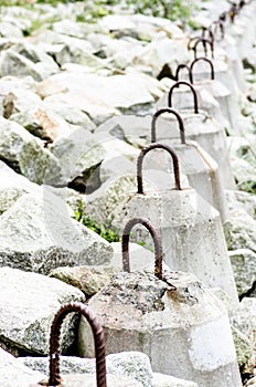 The breakwater in the form of a strip of stones stretches out into the sea