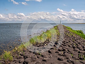 Breakwater between IJsselmeer lake en Trintelhaven harbour on Houtribdijk near Lelystad, Netherlands