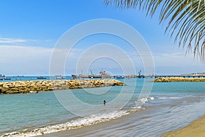 Breakwater at La Libertad Beach, Ecuador photo