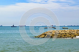 Breakwater at La Libertad Beach, Ecuador photo