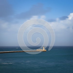 Breakwater with the lighthouse, Grand Harbour, Malta
