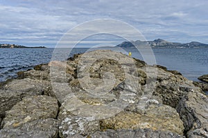 Breakwater by the Mediterranean sea on the island of Ibiza in Sp