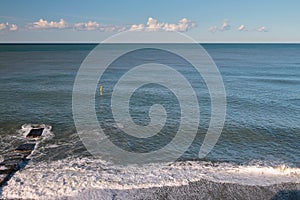 Breakwater and sea after last night`s storm. Adler, Sochi, Russia