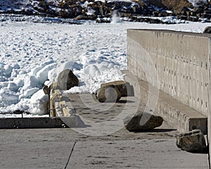 A breakwater and wharf were damaged by ocean ice.