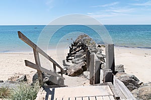 Breakwater and wooden path access in sand dune beach in Vendee Noirmoutier Island France