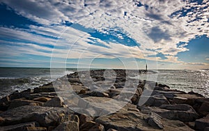 breakwaters and cloudy sky on barelona