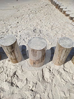 Breakwaters stump wooden. Shadows of people on the pier. Baltic Sea view from Svetlogorsk, Kaliningrad region